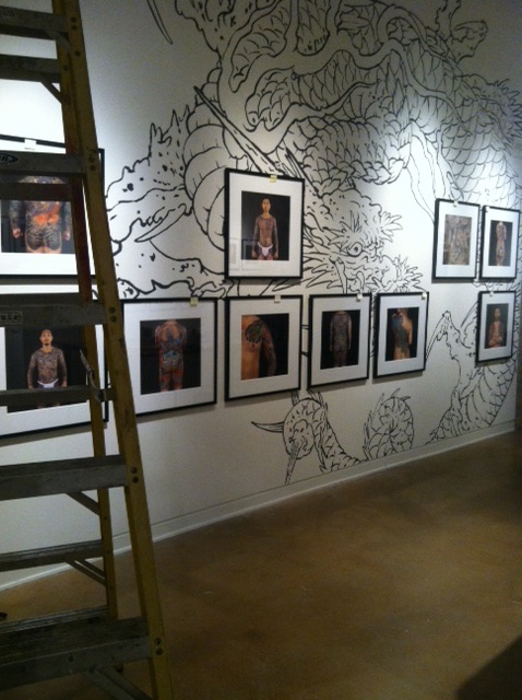 A Dragon lurks behind the photographs