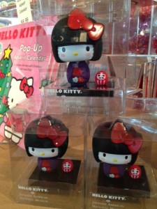 Can you spot Hello Kitty bobblehead's little Daruma friend?