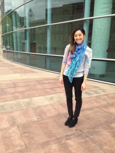 Staci Yamanishi stands next to her Children's Courtyard engraving.