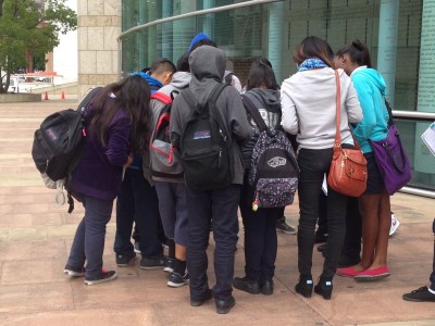 Staci Yamanishi's eighth-grade students discover her name engraved on JANM's Children's Courtyard.