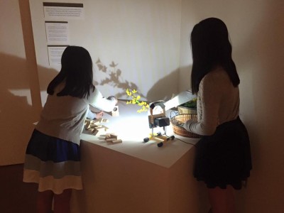 In a special corner of the Making Waves exhibition, guests are invited to play with light and shadow and upload photos of their results to social media with the hashtag #JANMMakingWaves. Photo by JANM.