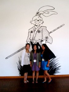 2011 Getty interns Yuiko Sugino, Alexa Kim, and Alyctra Matsushita, in front of a wall drawing by Stan Sakai.