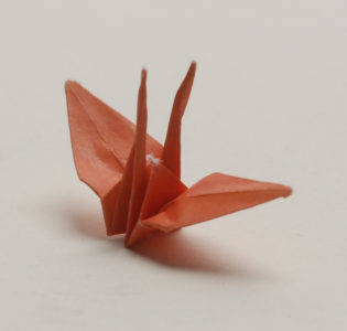 An original crane folded by Sadako Sasaki, now on view at JANM. Photo by Norman Sugimoto.