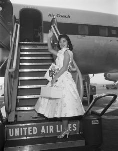 1955 Nisei Week Queen Stella Nakadate departs for Hawaii from LAX. Photo by Toyo Miyatake Studio. Japanese American National Museum, Gift of the Alan Miyatake Family.